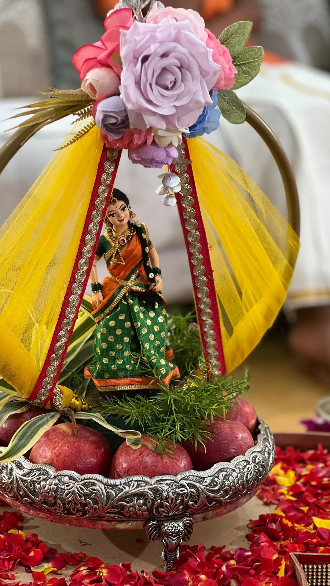 Floral dome plated tray with Indian doll and apples