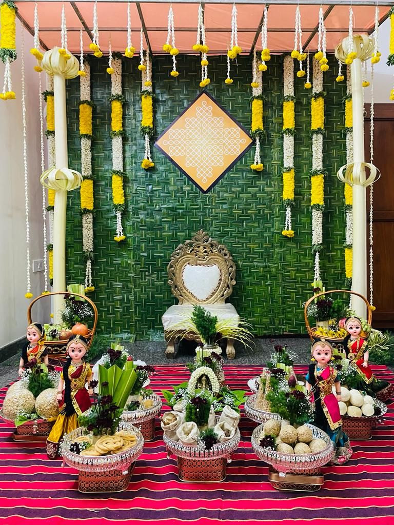 Seemantham stage with banana-leaf backdrop and dolls