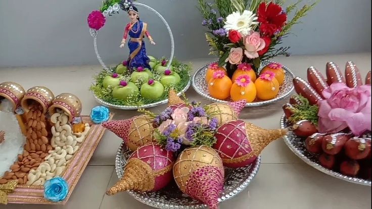 Traditional plated decor with apples, oranges and dry fruits