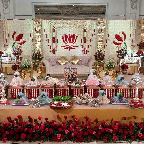 Grand wedding stage with plated fruit and sweet trays